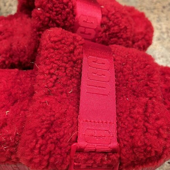 Ugg fuzzy woman's red slippers. They have some dirt and grass on them - Picture 3 of 9